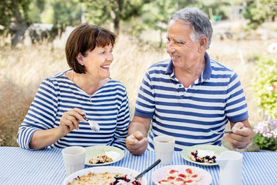 Mature couple having meal outdoor