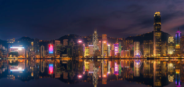 Reflection of illuminated buildings in water