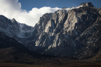 Panoramic view of snowcapped mountains against sky