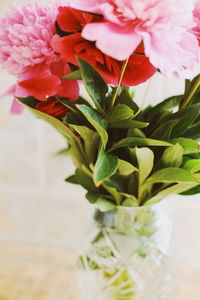 Close-up of pink flower vase on table