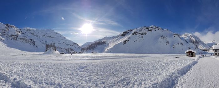 Scenic view of snow covered mountains against sky