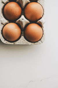 High angle view of eggs on white table