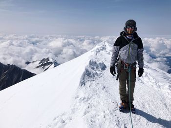 Man standing on snowcapped mountain