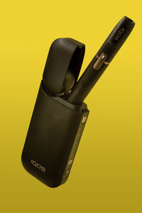 High angle view of telephone on table against yellow background