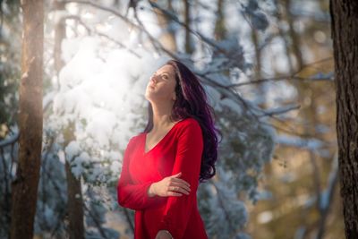 Woman standing in forest