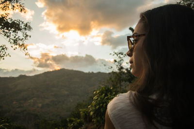 Close-up of thoughtful young woman during sunset