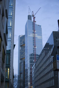 Low angle view of skyscrapers against sky