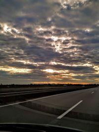 Road by airplane against sky during sunset