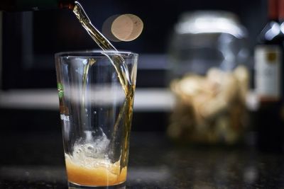 Close-up of beer glass on table