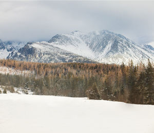 Scenic view of snowcapped mountains against sky