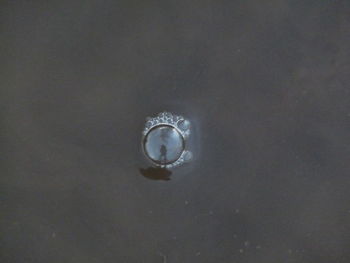 Close-up of water drop against sky