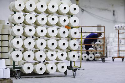 Spools on rack in factory