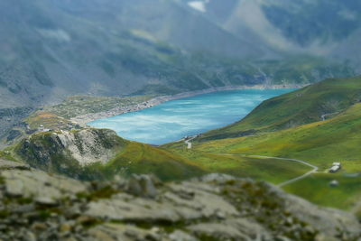 Scenic view of sea and mountains against sky