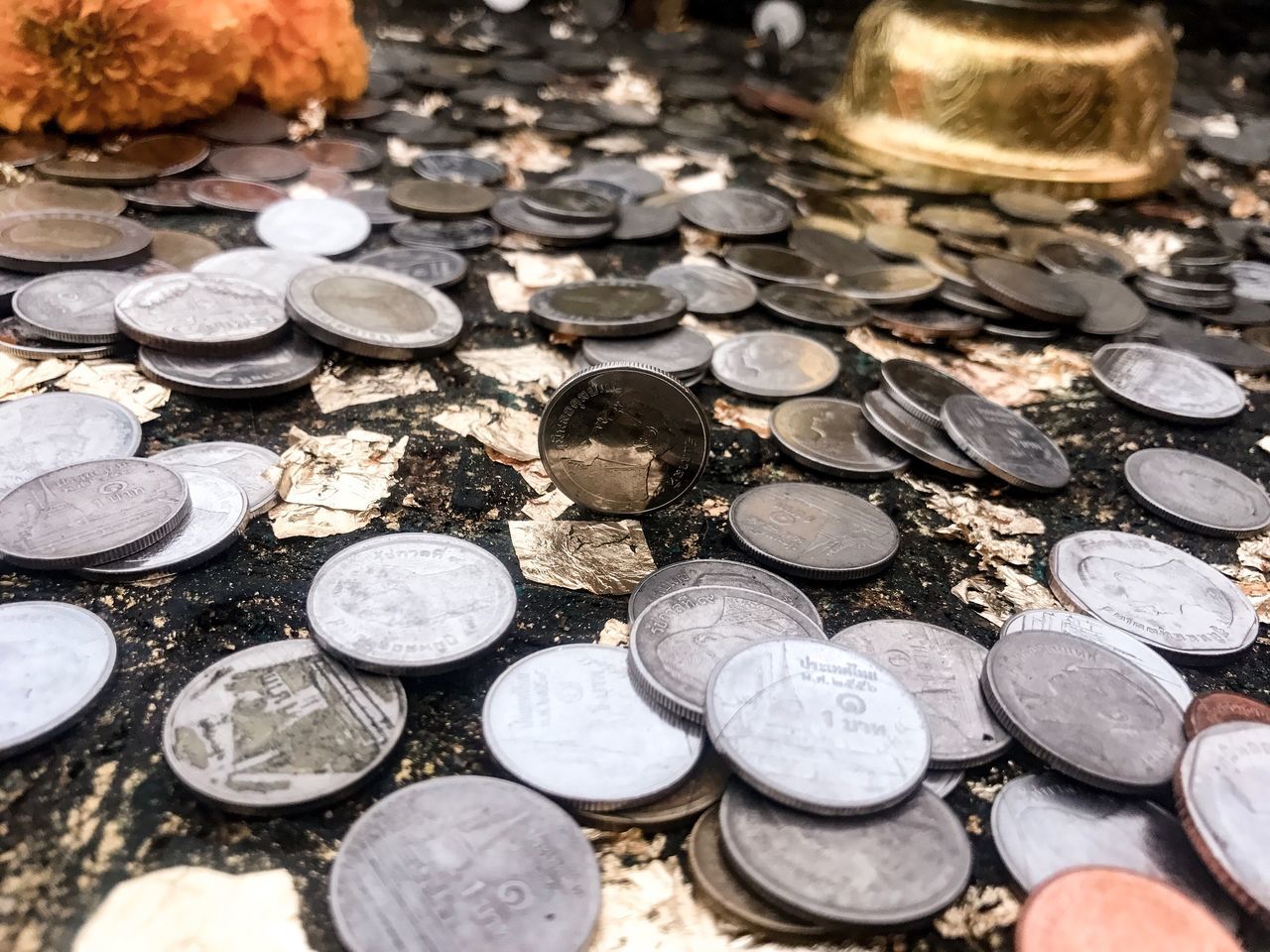 large group of objects, no people, coin, outdoors, currency, day, close-up