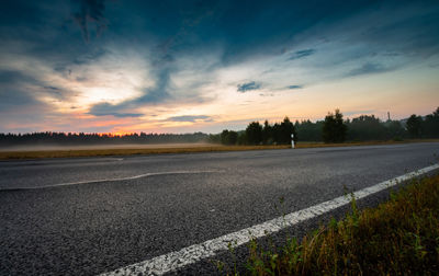 Scenic view of road against sky during sunset