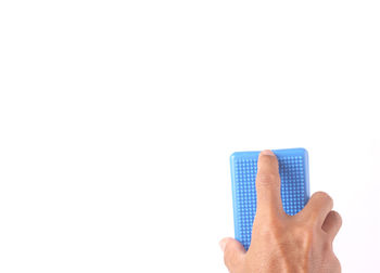 Close-up of person hand against white background