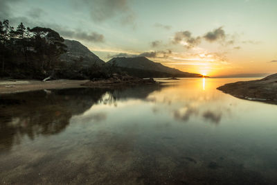 Scenic view of mountains against sky during sunset