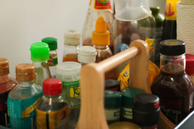 Close-up of multi colored bottles on table