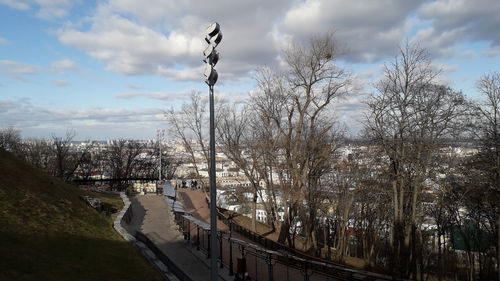 Panoramic view of city by road against sky