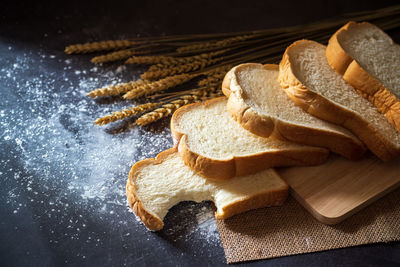 High angle view of bread on cutting board