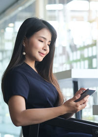 Young woman using mobile phone