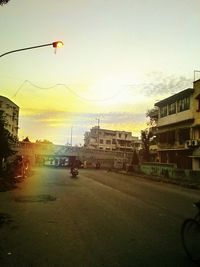 Buildings in city at sunset