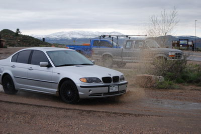 Cars on car against sky