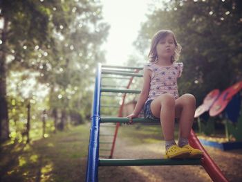 Low angle view of girl playing in playground