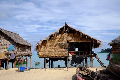 Built structure on beach against sky