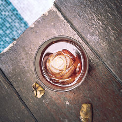 Close up of ice coffee drink in glass beside the pool