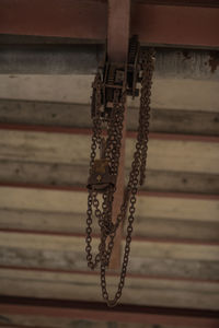 Close-up of chain hanging on rope