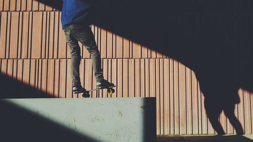 Low section of people standing on tiled floor