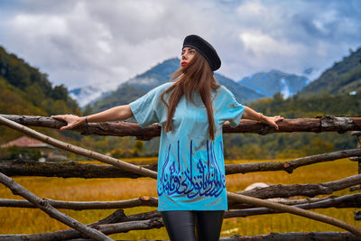 Woman standing against sky