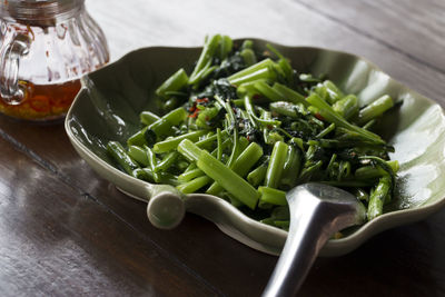 High angle view of vegetables in plate on table