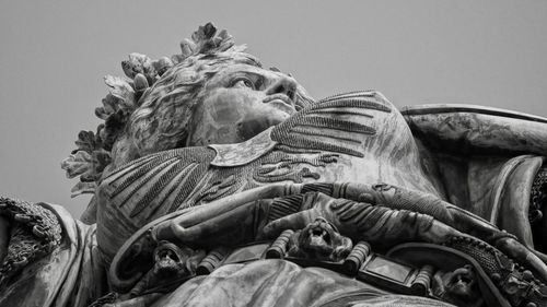 Low angle view of statue against sky