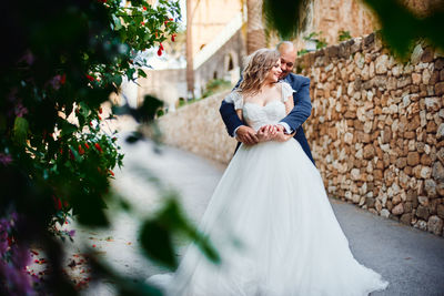Woman standing on field by plants