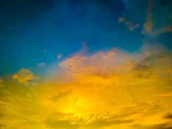 Low angle view of dramatic sky during sunset