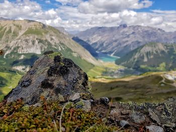 Scenic view of rocks in mountains against sky