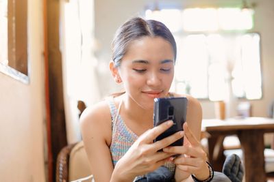 Young woman using mobile phone