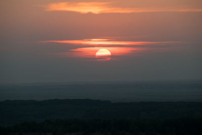 Scenic view of silhouette landscape against romantic sky at sunset