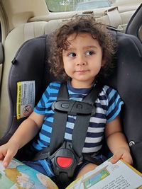 Portrait of boy sitting in car