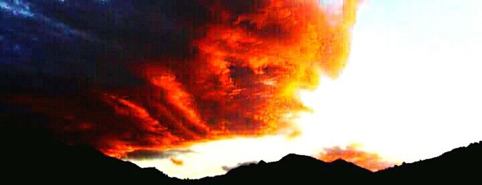 Scenic view of mountains at sunset