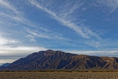 View of mountain range against cloudy sky