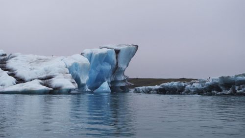 Scenic view of frozen sea against clear sky