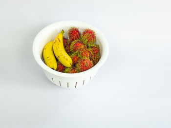 High angle view of fruits in bowl on table