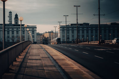 Street amidst buildings against sky in city