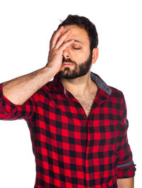 Mid adult man looking away against white background