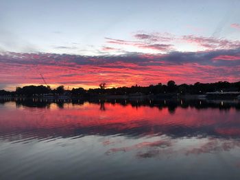 Scenic view of lake against orange sky