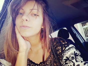 Portrait of beautiful woman in car