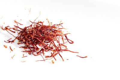 Close-up of dried plant against white background